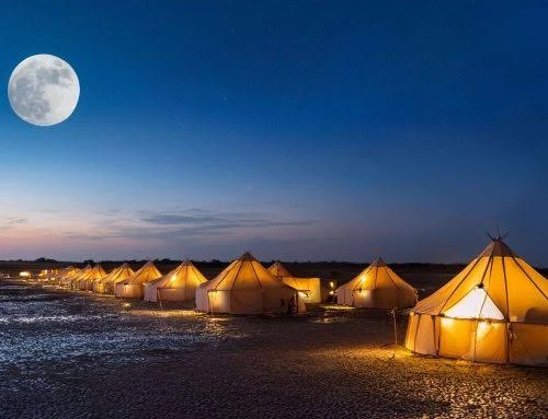Full moon rising over the illuminated Dhordo Tent City